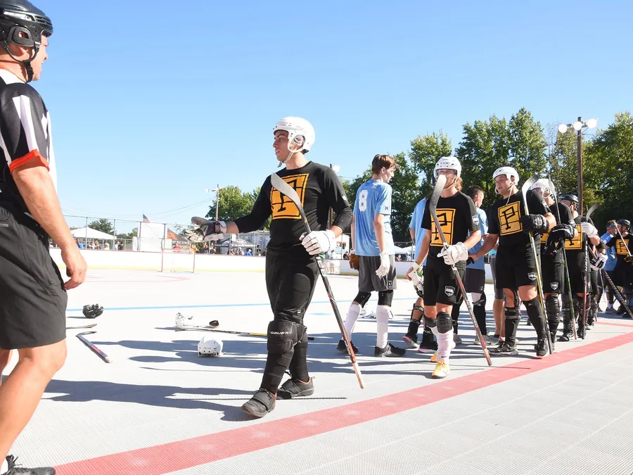 The handshake line after the 2021 Mylec Cup Tier 1 final in Marlton, with Mark in the black and gold Pioneers jersey.