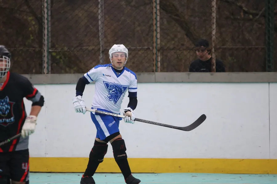 Mark in the white and blue Cranberry Apocalypse jersey, skating in a 2025 NBHL game against the Mon Valley Wolfpack.